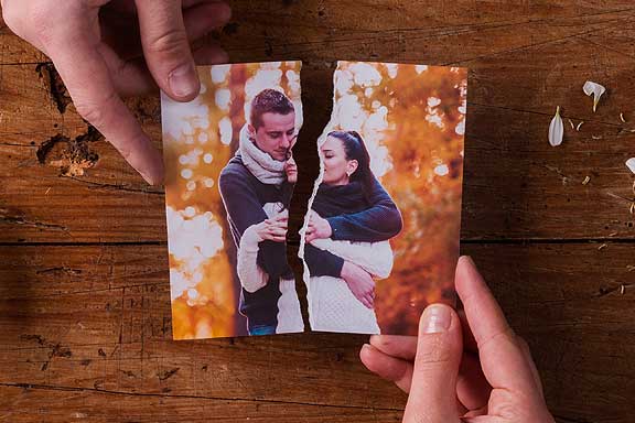 physical photo of divorced couple ripped in half